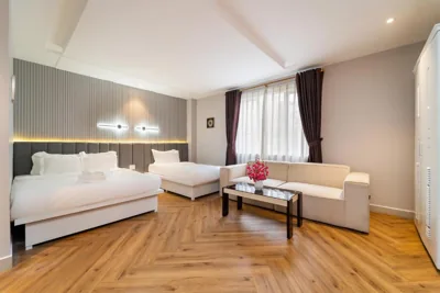 Chambre triple avec baignoire — Golden Suites Saigon